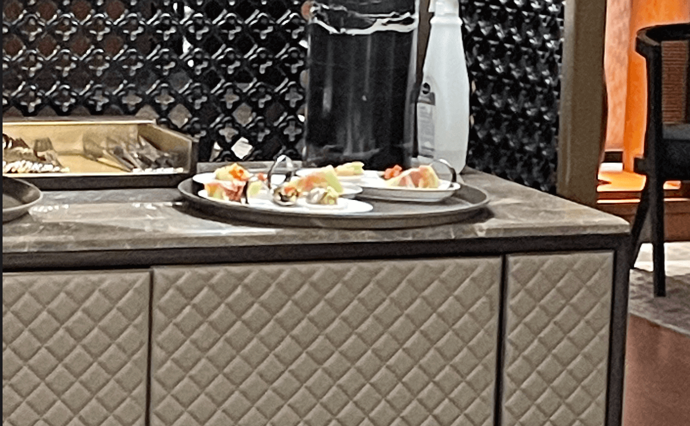 Luxury hotel welcome refreshments and canapés presented in a guest suite