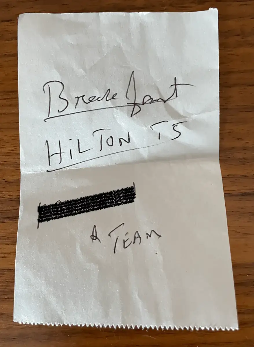 Handwritten hotel feedback request left for a Guest
